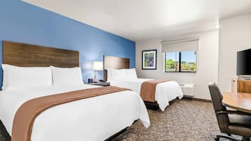 Premium bedding, pillow-top beds, desk, laptop workspace