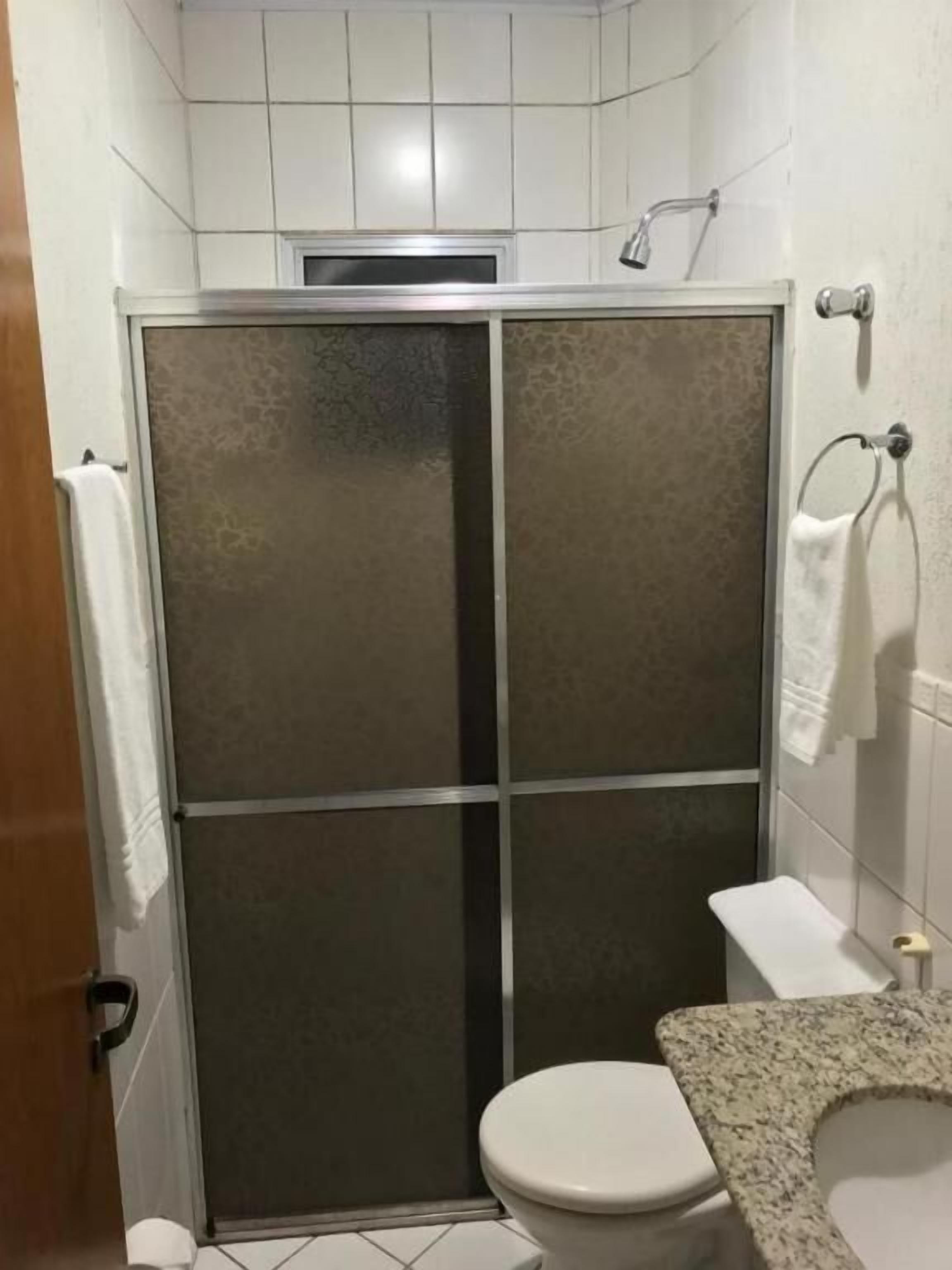 Shower, towels, soap, toilet paper