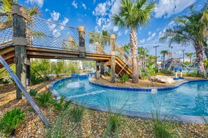 A swimming pool with a wooden deck, palm trees, and a rope bridge. - Modern Clean Design Near Disney Top Resort (Kissimmee)