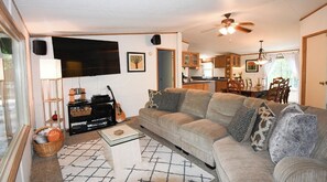 Living area - Cozy cabin escape- Unwind by the firepit & relax on the spacious deck (Vian)