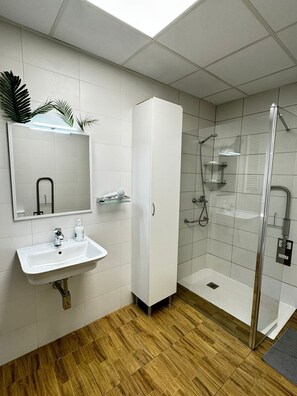 Shower, hair dryer, towels, soap