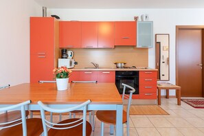 Apartment, Pool View | Private kitchen | Full-size fridge, microwave, oven, dishwasher