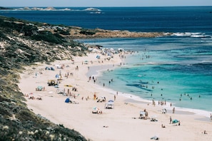 A beach with people, tents, and a rocky shoreline. - Pet-friendly. Bright and Spacious Dunsborough Home (Dunsborough)