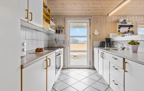 Fridge, stovetop, dishwasher, coffee/tea maker