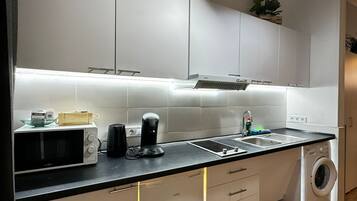 Fridge, microwave, stovetop, coffee/tea maker