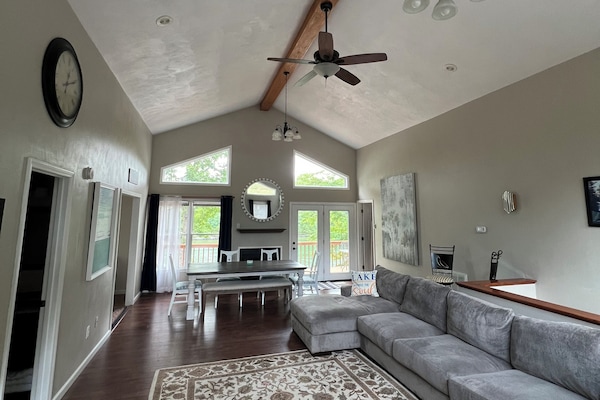 Great room entry see the lake and huge sectional sofa for you and your family!