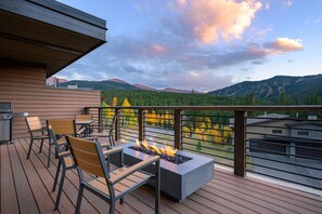 A deck with outdoor seating and a fire feature, overlooking a mountainous landscape. - Winter Park Resort Villa 211 I Private Hot Tub I Great Views I Arcade I Discounted Attractions (Winter Park)