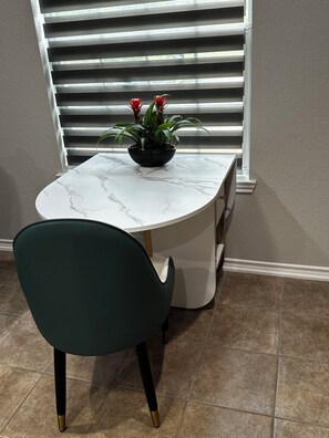 Enjoy meals in this dining area with a beautiful table and comfortable seating.