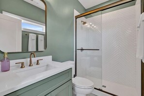 Shower, hair dryer, towels, shampoo