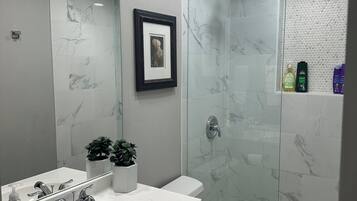 Shower, hair dryer, towels, soap