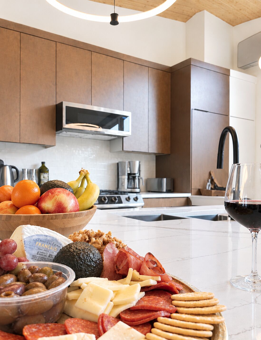 A kitchen with wooden cabinets, a microwave, and a coffee maker.