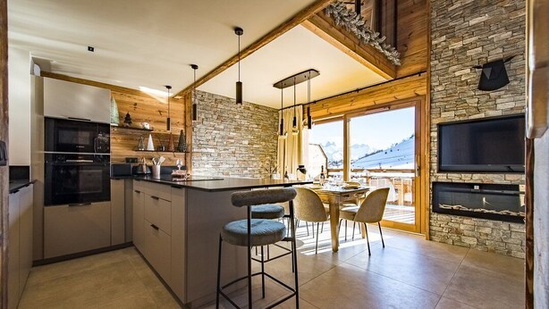 A modern kitchen with a central island, bar stools, and a dining area with a view of mountains. - Duplex for 6/8 people in a new residence on the slopes (LA TOUSSUIRE)