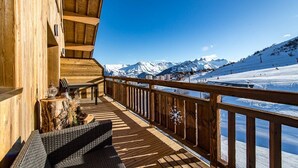 A wooden deck with a view of a snowy mountain landscape. - Duplex for 6/8 people in a new residence on the slopes (LA TOUSSUIRE)