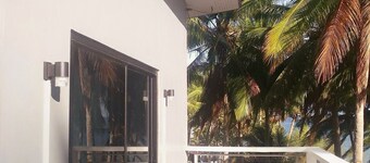 A 3 floor contemporary styled beach house. Steps away from fine white sands!