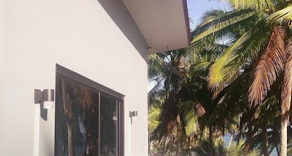 A 3 floor contemporary styled beach house. Steps away from fine white sands!