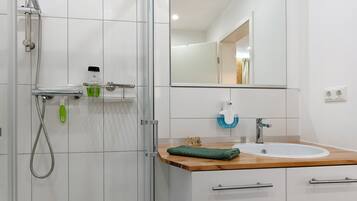 Shower, hair dryer, towels