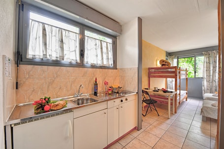 Standard Studio (Chiasso Apartments 203) | Private kitchen | Fridge, stovetop, cookware/dishes/utensils, freezer