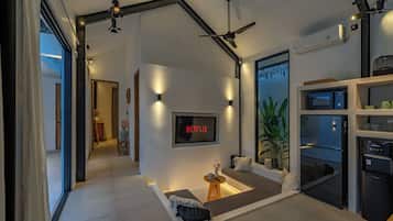 Deluxe Villa, 2 Bedrooms, Patio, Pool View | Living area | 52-inch LED TV with cable channels