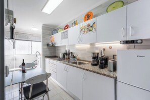 Fridge, microwave, stovetop, coffee/tea maker