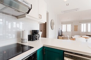 Enjoy cooking in this well-equipped kitchen with an oven, induction cooktop, and dishwasher.