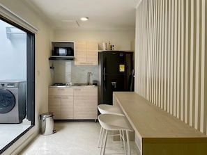 Fridge, microwave, stovetop, coffee/tea maker