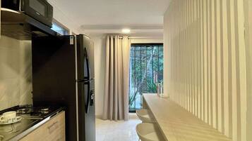 Fridge, microwave, stovetop, coffee/tea maker