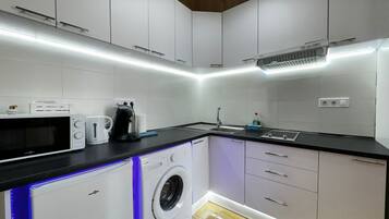 Fridge, microwave, stovetop, coffee/tea maker