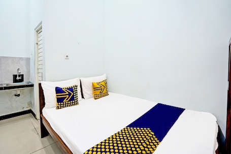 Double Room | Bed sheets. Hotel O Jati Guest House