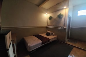 Economy Double Room | Laptop workspace, bed sheets - Hotel O Mekar Guest House Syariah (Mekargalih)
