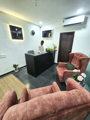 32-inch Smart TV with satellite channels, fireplace - Innzoy Hotels (Hyderabad)