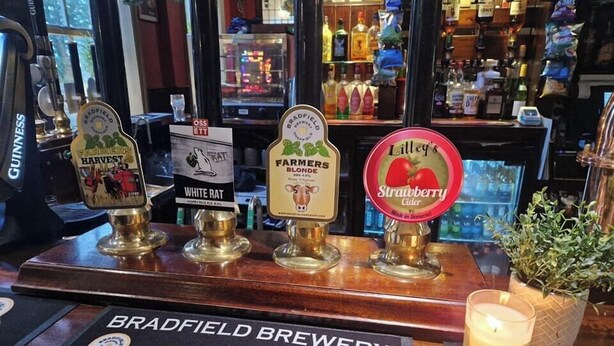 A bar with various beer taps, including brands like Guinness and Lillie’s Strawberry Cider. - The Shepherds Rest (Sowerby Bridge)