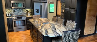 Luxury Lodge with stream in backyard