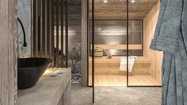 A modern bathroom with a large black basin, wooden accents, and a visible sauna area.