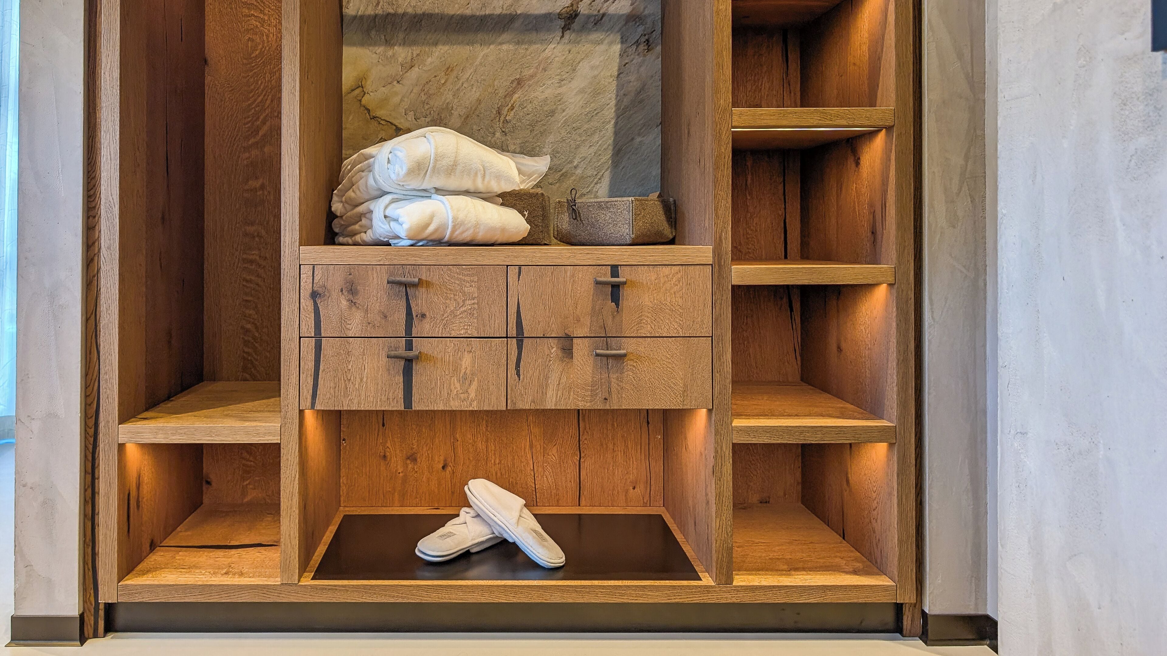 A wooden wardrobe with two drawers and a shoe shelf.