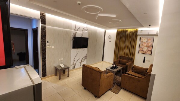Deluxe Apartment, 2 Bedrooms, Kitchenette | Living area | 45-inch plasma TV with satellite channels - Afaq Suite Al- Shamisi - افاق سويت الشميسى (Riyadh)