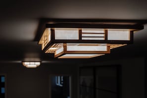 A modern ceiling light fixture with a geometric design.