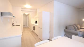 Standard Apartment | Living area | 32-inch TV with cable channels