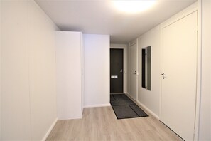 Standard Apartment | Living area | 32-inch TV with cable channels