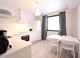 Standard Apartment | Private kitchen | Fridge, microwave, oven, stovetop