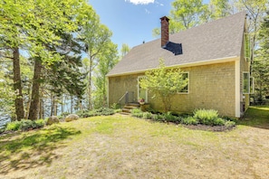 A single-story house with a brick exterior, a chimney, and a front porch. - Serene Steuben Home w/ Scenic Ocean Views! (Steuben)