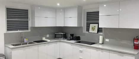 Fridge, microwave, stovetop, coffee/tea maker