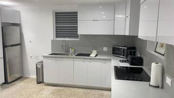 Fridge, microwave, stovetop, coffee/tea maker