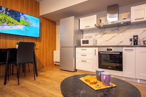 Apartment, 1 Bedroom, Balcony | Private kitchen | Toaster, paper towels, dining tables