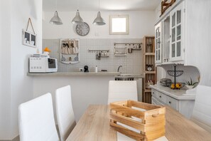 Fridge, microwave, electric kettle, cookware/dishes/utensils