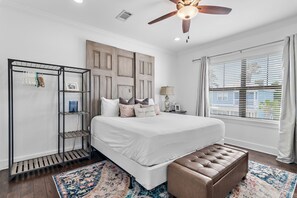 A bedroom with a bed, a bench, a wardrobe, a window with blinds, and a ceiling fan. - 🌊 Sundaze 30A – Walk to Beach-4 Bikes Included 🚲 (Santa Rosa Beach)