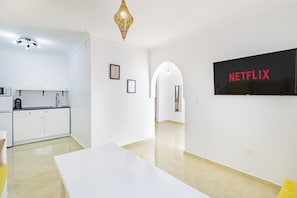 Deluxe Penthouse, 2 Bedrooms | Living area | 50-inch Smart TV with digital channels