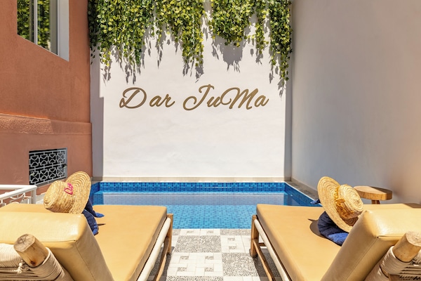 Outdoor pool, a heated pool, open 10:00 AM to 9:00 PM, sun loungers