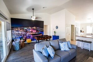 Smart TV, fireplace, foosball, books