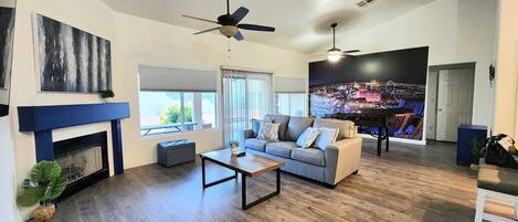 Smart TV, fireplace, table football, books