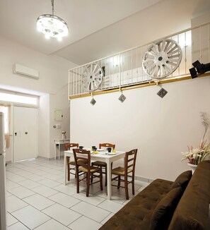 Apartment | Living area | 32-inch flat-screen TV with cable channels